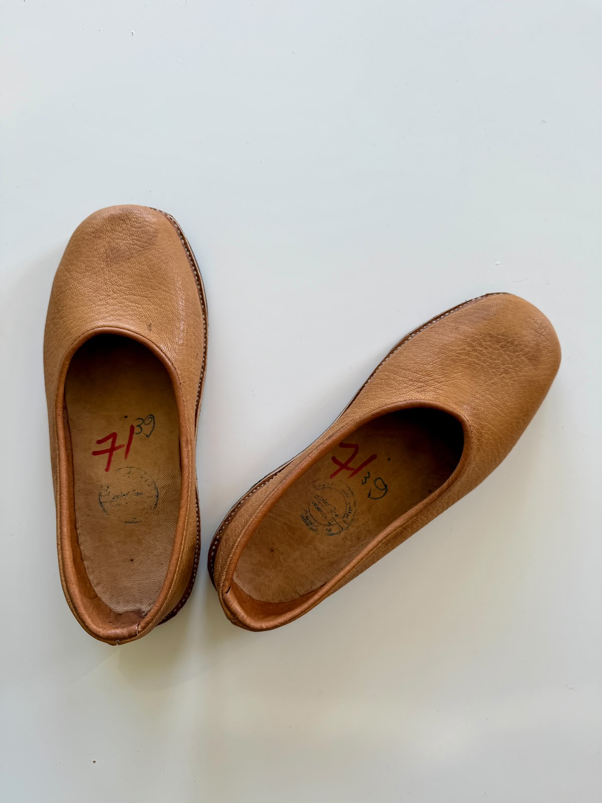 Original warm tan marqub pair with rounded toes and visible edge stitches